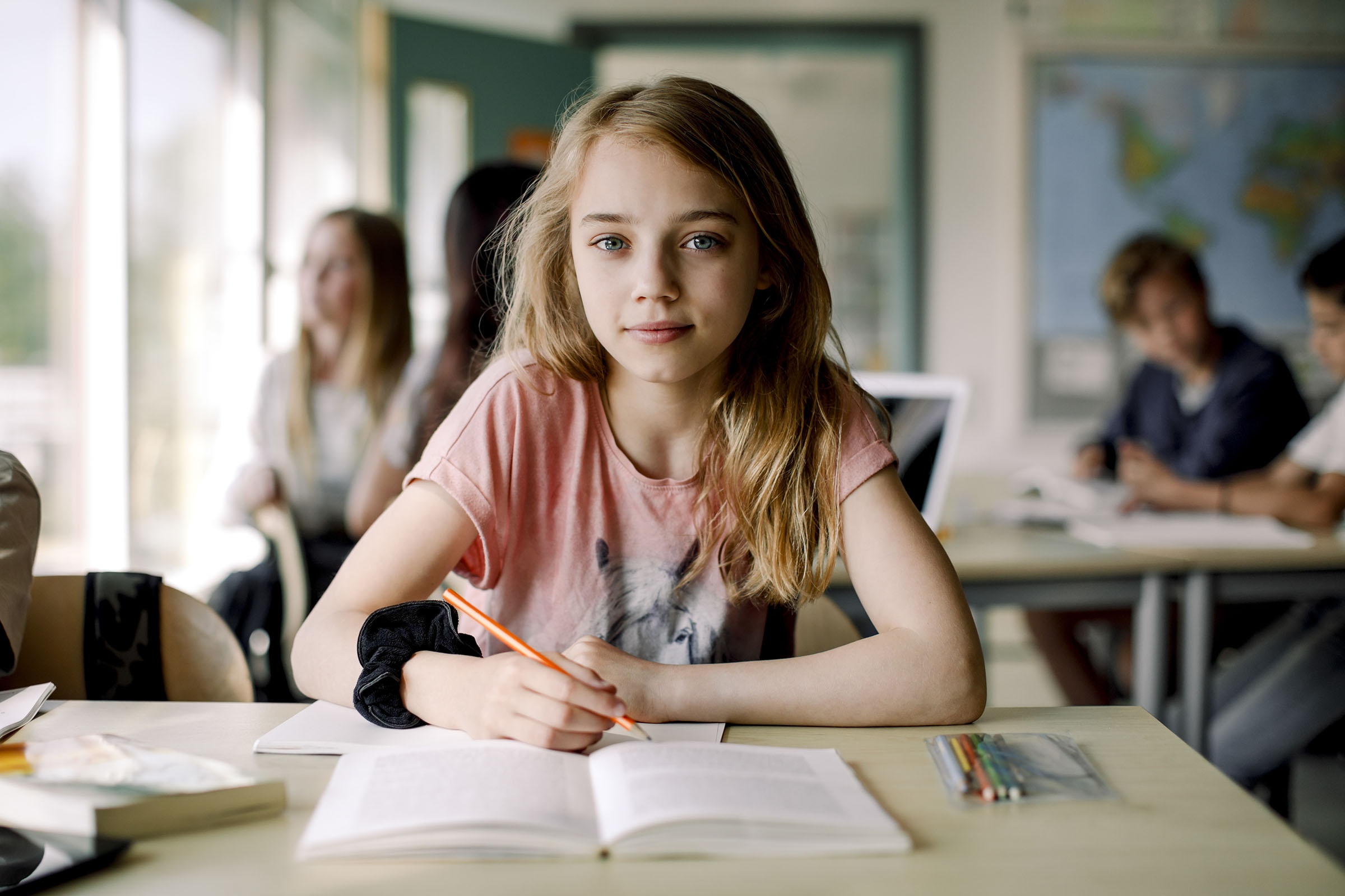 young girl at school desk